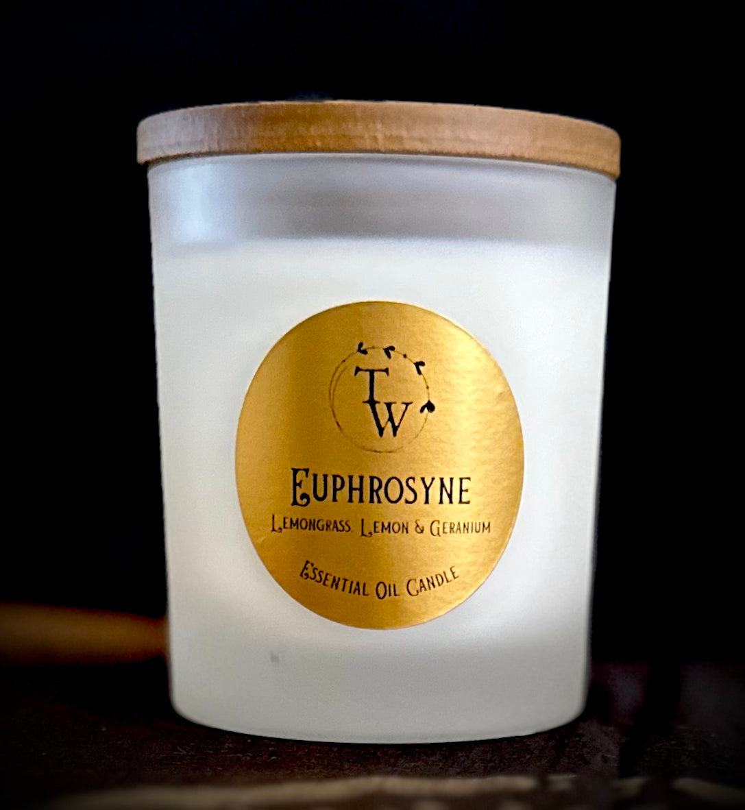 Euphrosyne lemon candle in frosted glass jar with wooden lid and gold label