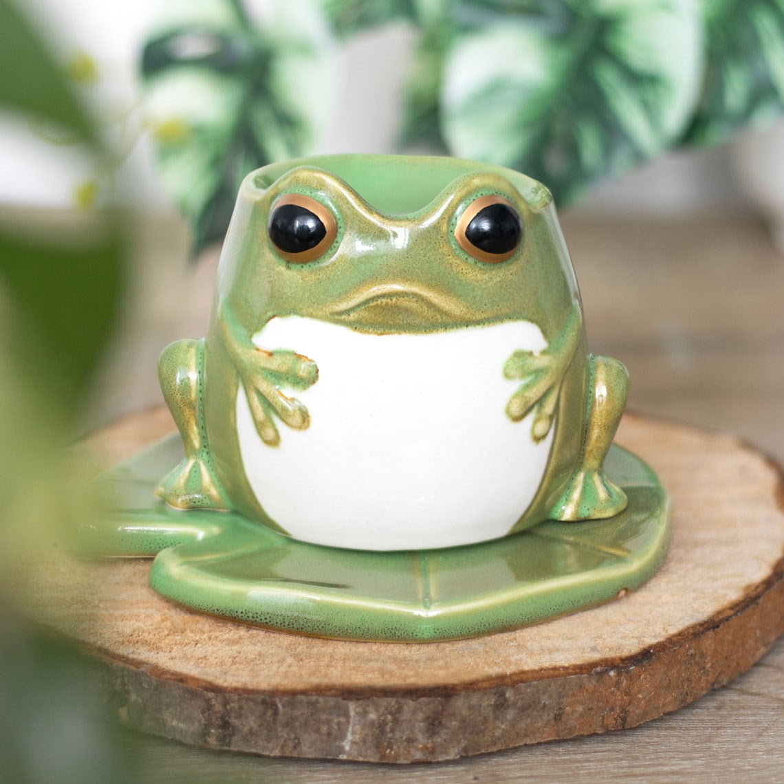 Cute Frog oil burner sitting on a matching lily pad.