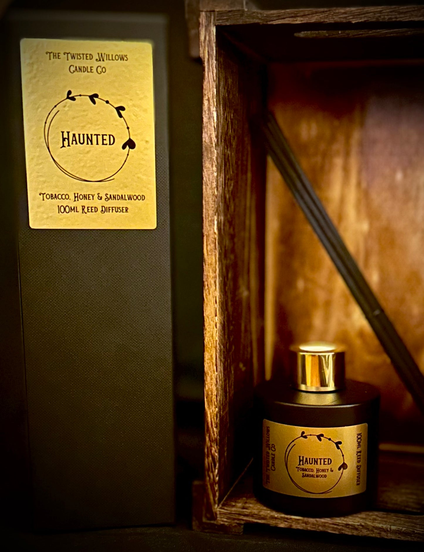 Haunted Gothic Reed Diffuser - Matte black glass bottle with gold label and black reeds in a luxury black box.
