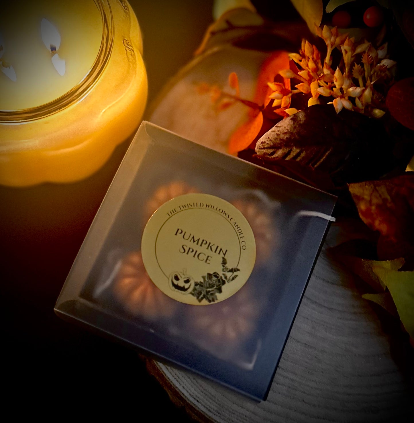 Set of four miniature pumpkin-shaped wax melts in pumpkin spice scent