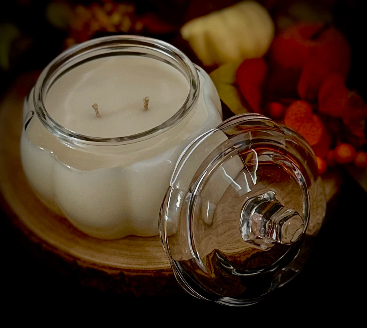 Creamy soy wax inside a clear glass pumpkin container