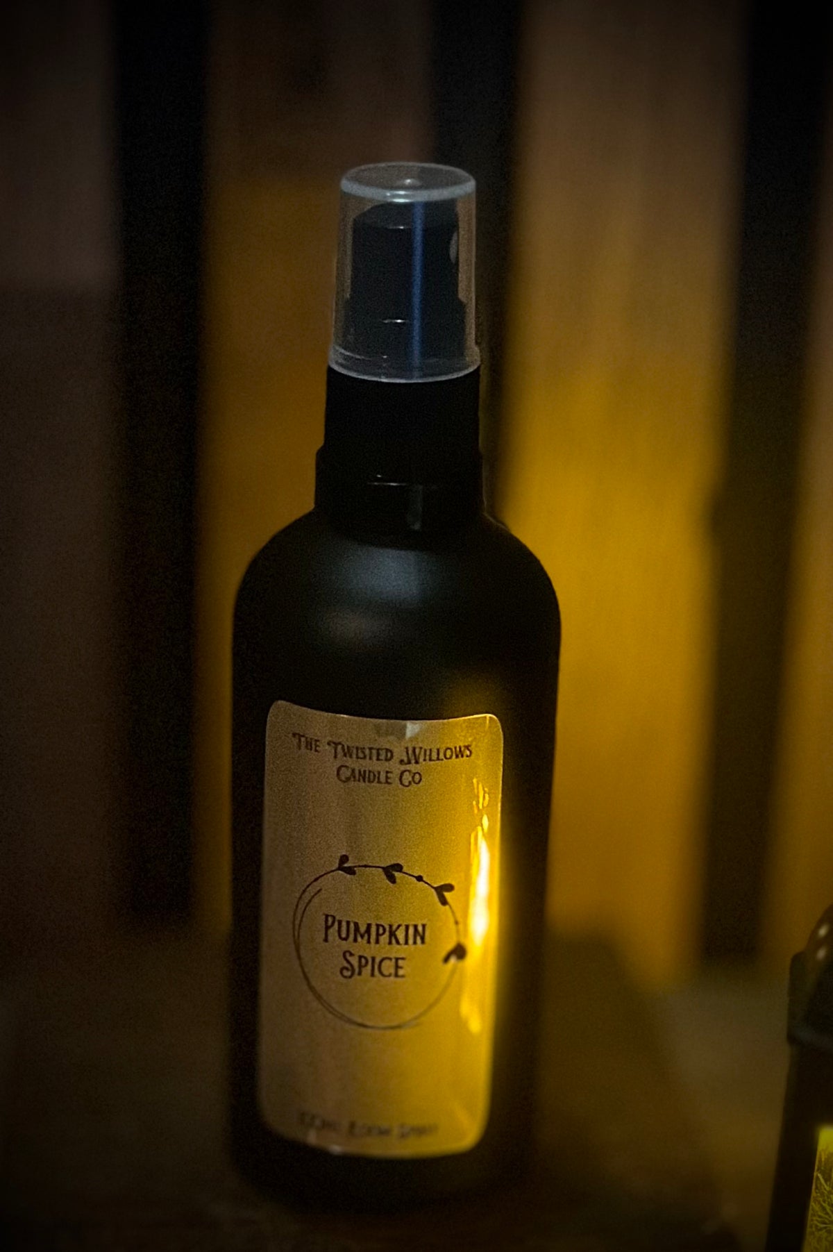 luxury black glass room spray bottle with gold detailing from The Twisted Willows Candle Co