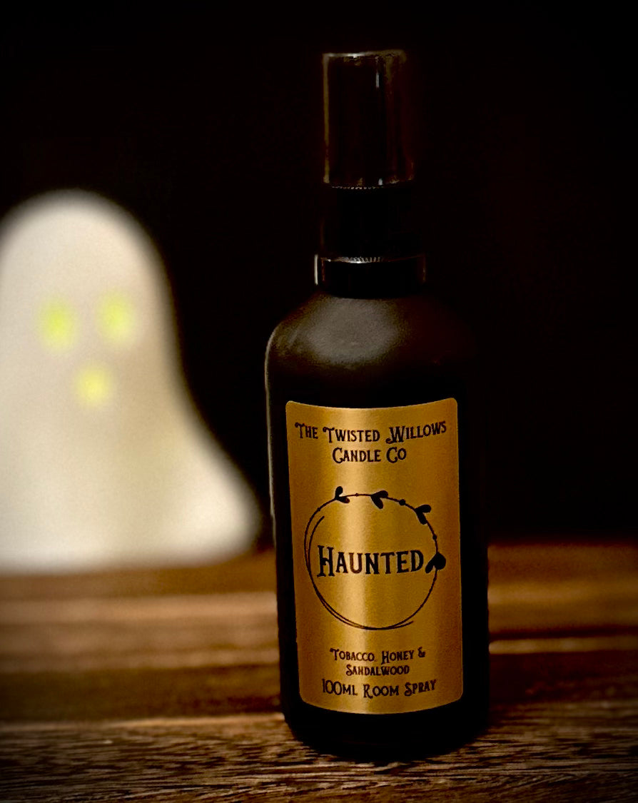 Haunted Gothic Room Spray in matte black glass bottle with gold label, scented with dark honey, tobacco and sandalwood.