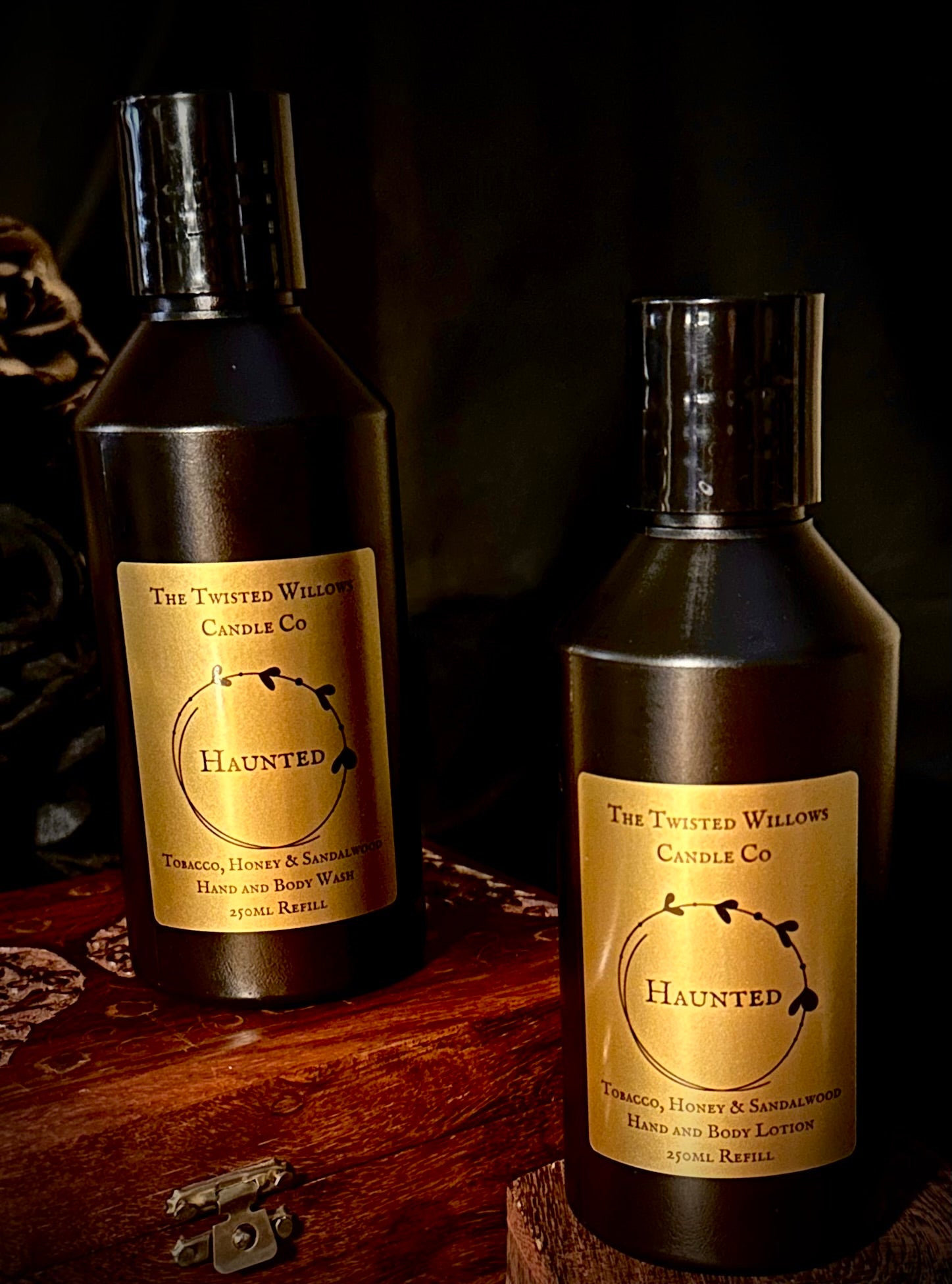 A 250ml black plastic refill bottle for Haunted Hand and Body Wash, a spectral scent with tobacco, honey and sandalwood.