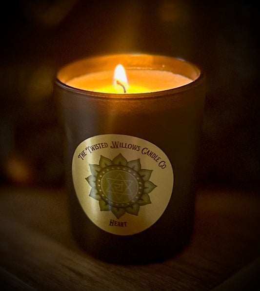Heart Chakra votive candle with geranium, pine and ylang ylang essential oils in creamy soy wax.