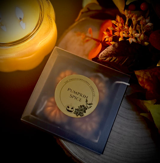 Set of four miniature pumpkin-shaped wax melts in pumpkin spice scent 