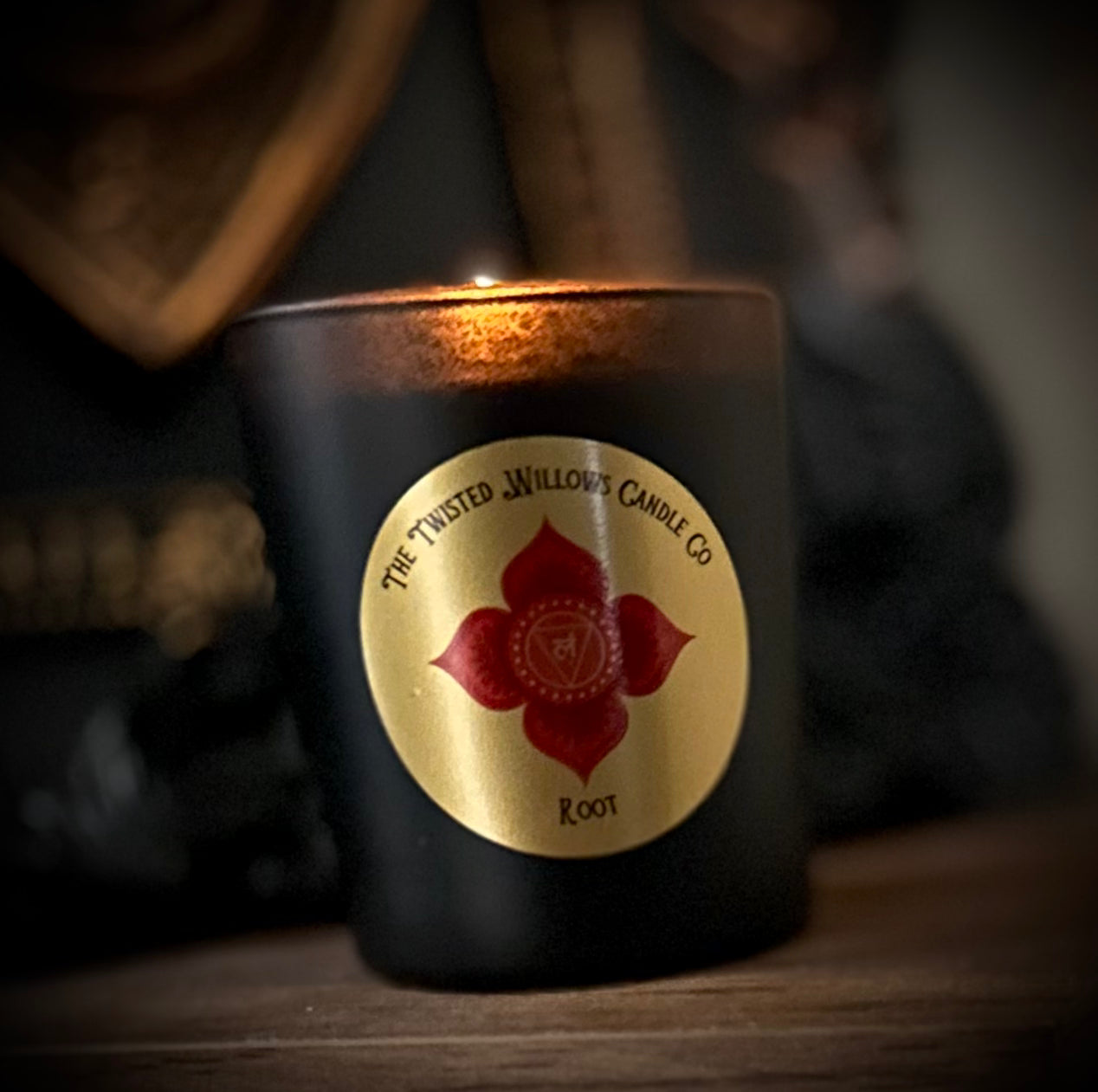 Lighting a Root Chakra soy wax candle for grounding, emotional release and stress relief in a cosy sacred space.