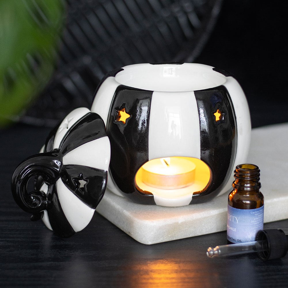 Striped Pumpkin Oil Burner without lid and a cosy lit tea light.